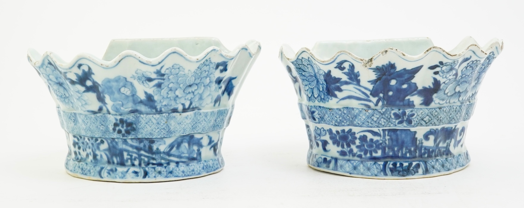 A pair of unusual Chinese export blue and white bough pots, after a Delft model, Qianlong period